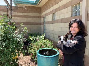 The third photo includes Riverside County Animal Services Director Julie Bank holding Milkshake, a pet belonging to Ryan Long, an operations chief who oversees the Jurupa Valley shelter.