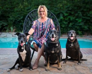 Tamara Hedges, president of the board of directors for The Friends of the Palm Springs Animal Shelter. She is featured with her three dogs (from left to right: Bailey, 9, Beatrix 7, and Sophie Pickle, 11)