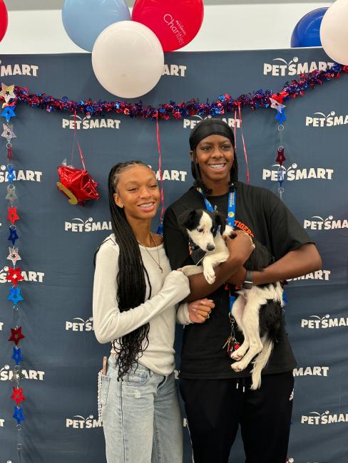 Man and Woman holding dog
