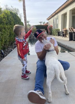 Father and Son bounding with new family member, Lola
